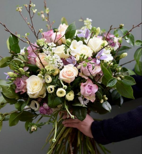 Photo showing a sample of a pastel Seasonal rose bouquet available from Kensington flowers, London