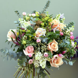 Photo showing a sample of a Seasonal rose bouquet in mix pastel colours available to order from Kensington flowers London