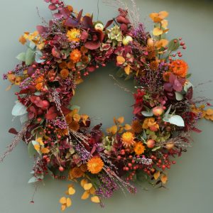 Photo showing a sample of an Autumnal wreath available to order from Kensington Flowers London