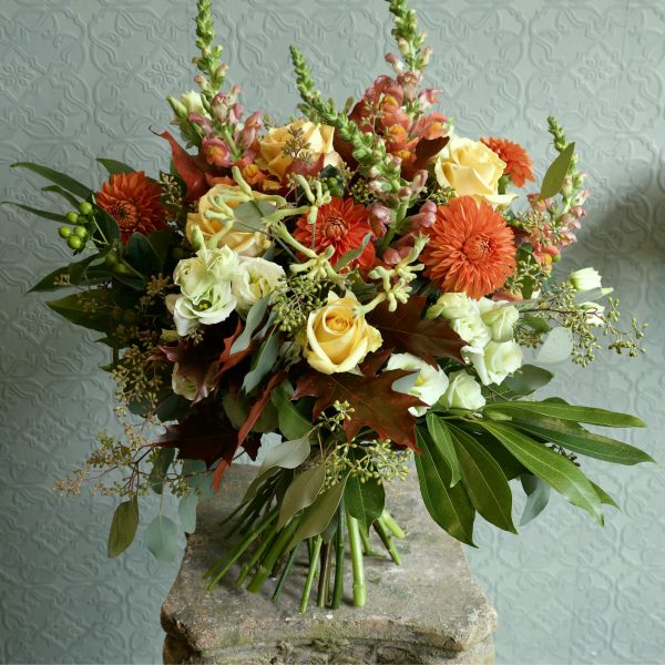 photo showing a sample of a autumanl seasonal rose bouquet available to order from Kensington flowers London