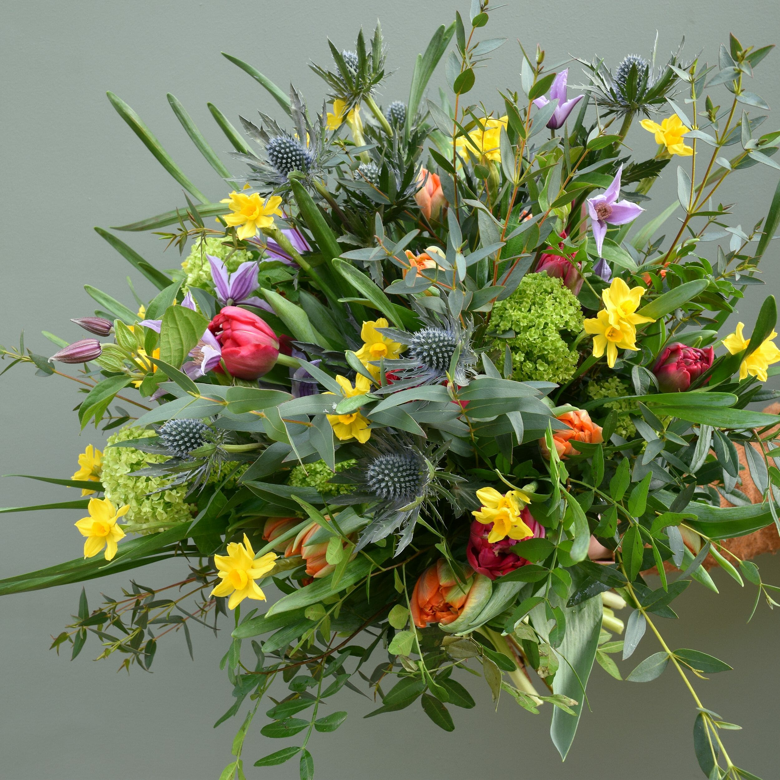 Photo showing a sample of a spring flower bouquet of mixed bright colouirs available to order from Kensington flowers London