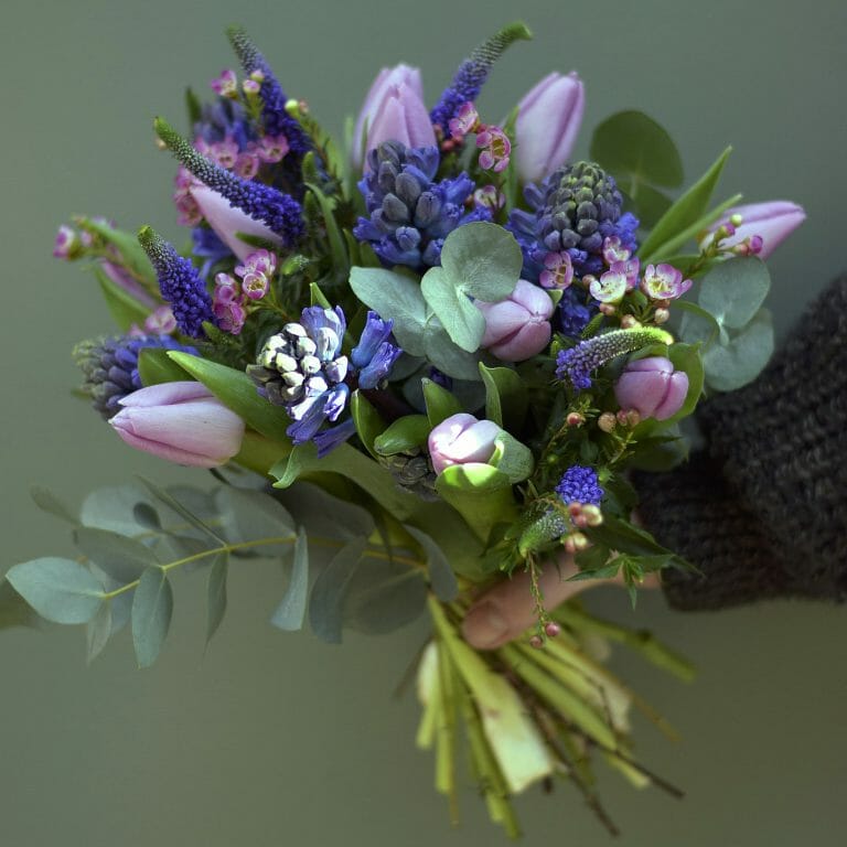 Photo showing a pink and purple/blue Spring Bouquet available to order from Kensington flowers, London