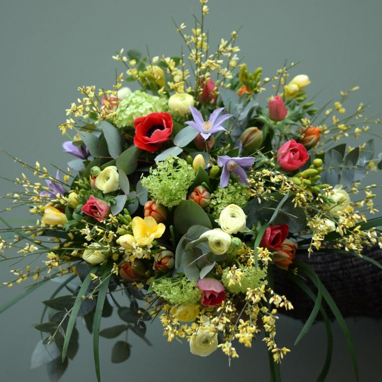 Photo showing a mixed colour Spring Bouquet available to order from Kensington flowers, London