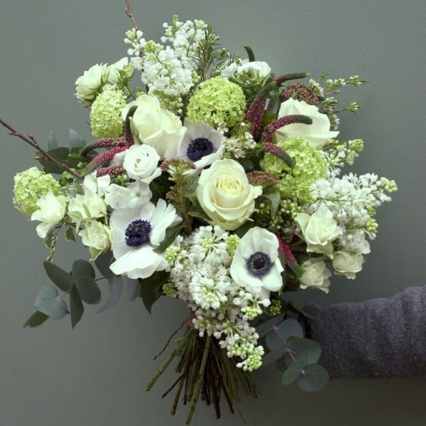 Photo showing a sample Seasonal rose bouquet with anemones available in Spring available from Kensington flowers London