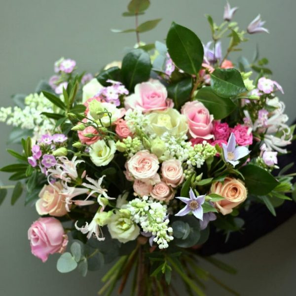 Photo showing a Seasonal rose bouquet in pastel shades available to order from Kensington flowers