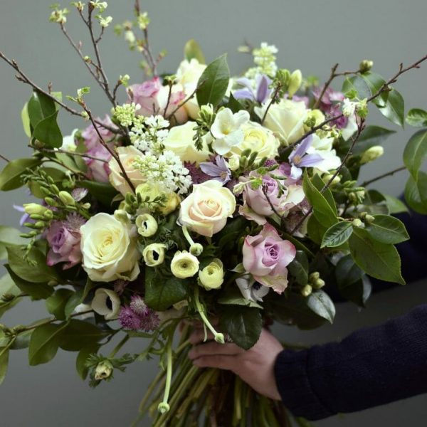 Photo showing a sample of a pastel Seasonal spring rose bouquet available from Kensington flowers, London
