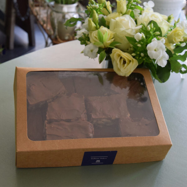 Photo showing a sample of a flower and chocolate tiffin gift set available to order at Kensington Flowers London