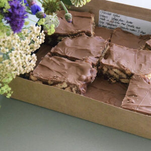 Boxed chocolate tiffin by Balham Bakes and a peak at a bouquet in the corner