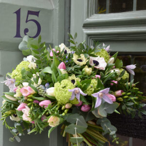 Photo showing a sample of a seasonal vase arrangement in blues, lilacs or white available to order from Kensington flowers London