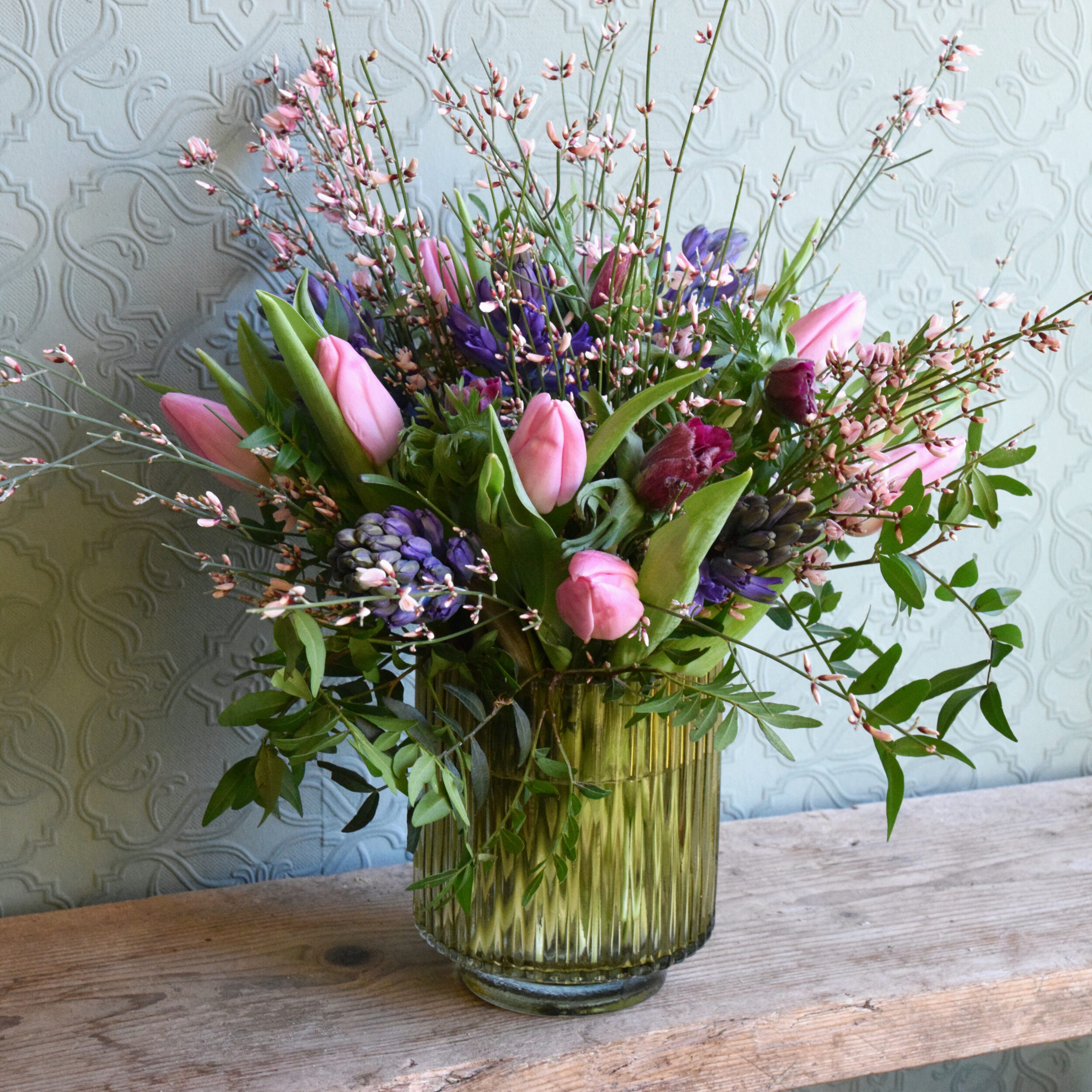 Photo showing a sample of a Spring flower vase arrangement in mixed colour available to order from Kensington flowers London
