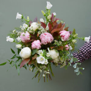 Photo showing a sample of a seasonal peony bouquet in pink and white available to order from Kensington flowers London