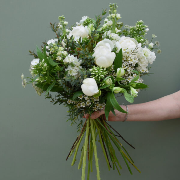 Photo showing a sample of a seasonal peony bouquet in white available to order from Kensington flowers London