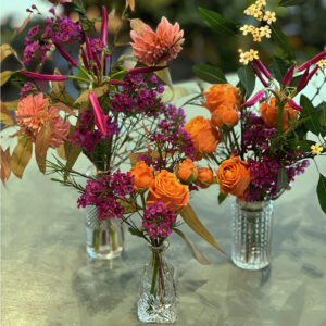 Photo shows a sample of the vintage flower bottles available to order from Kensington flowers London